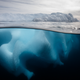 An underwater photo of an iceberg in the Southern Ocean offshore the Antarctic Peninsula.